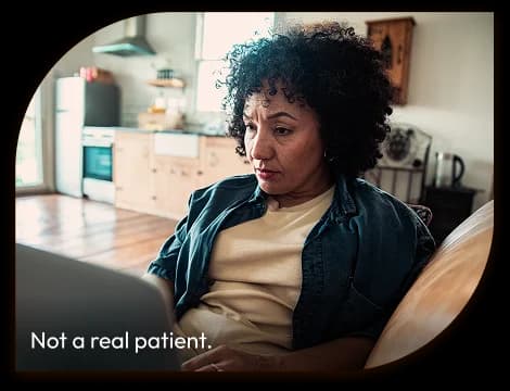 Woman using a laptop. Not a real patient