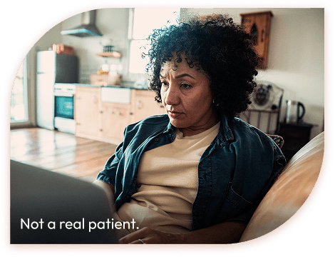 Woman using a laptop. Not a real patient